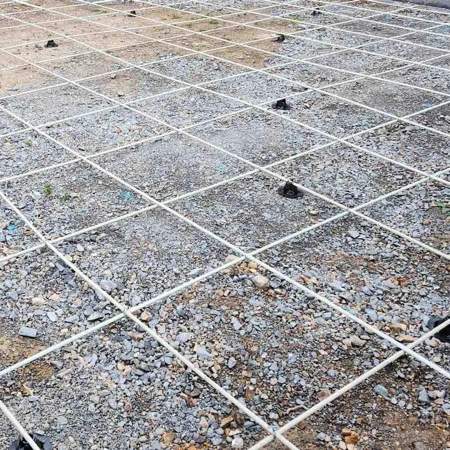 rebar at a construction site with accessories around it like ground chairs