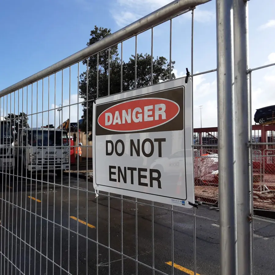 signage on a fence at a construction site