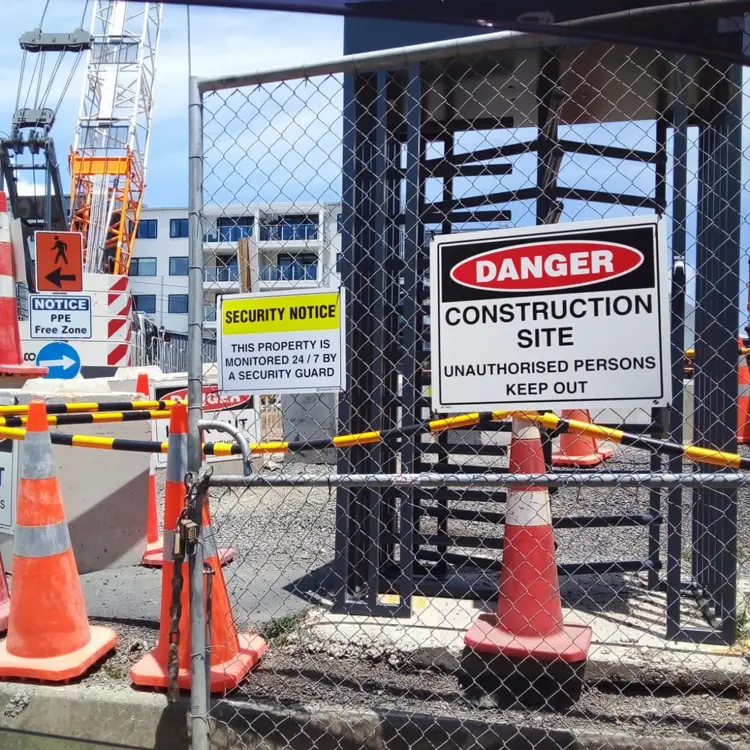 Construction site with multiple safety and warning site signage