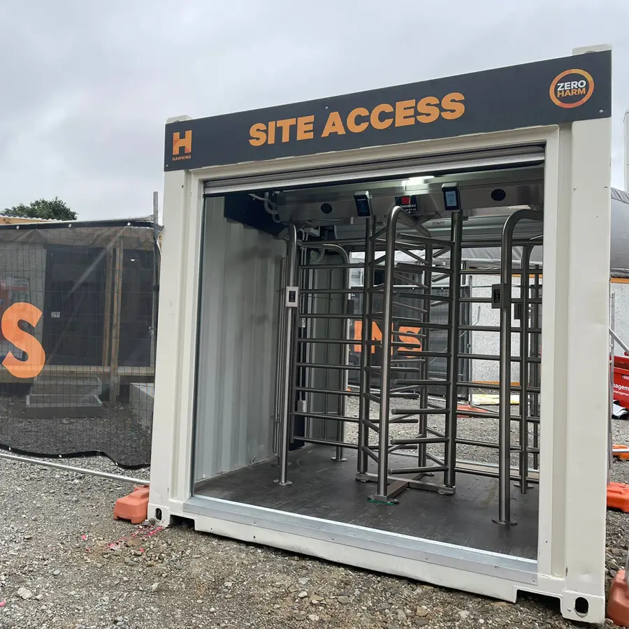 turnstile inside of container installed on construction site