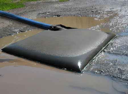 Ultra dewatering bag filled with muddy water and sediment