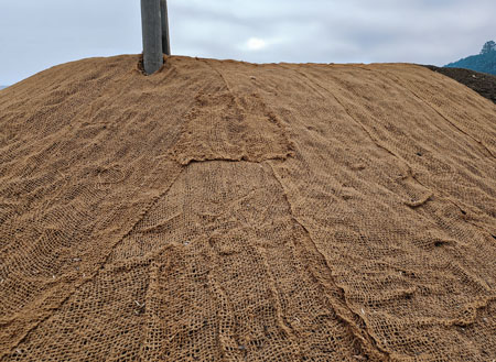 Coconut jute rolled out on a civil construction site used to protect grass and promote growth