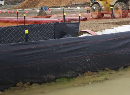 Silt fence wire with black silt fence and waratahs. Yellow safety caps keep construction site safe and illuminated